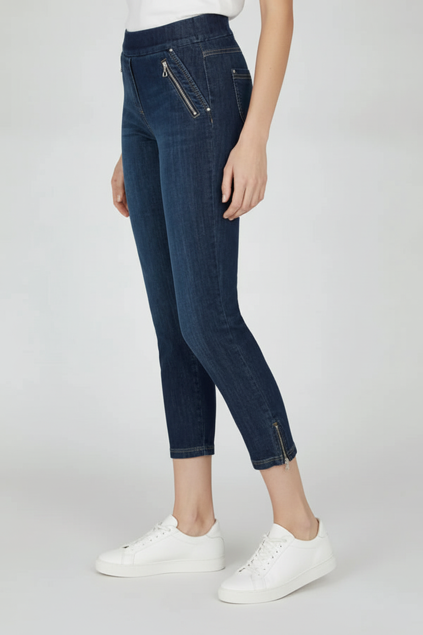 Dark denim trousers with white trainers