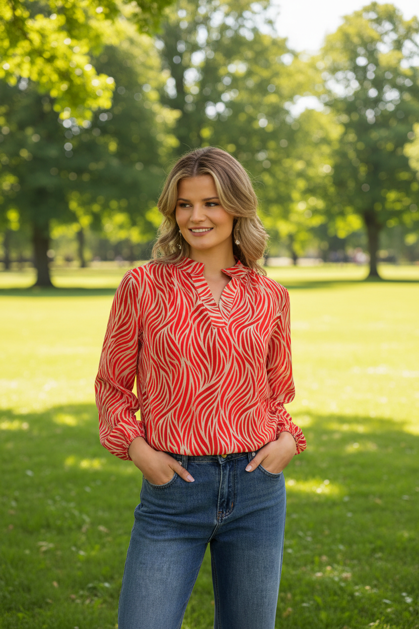 Red animal print top in park - upper body