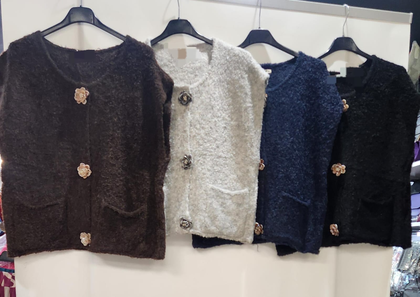 Supersoft Sleeveless knit with fabulous Flower button Detail
