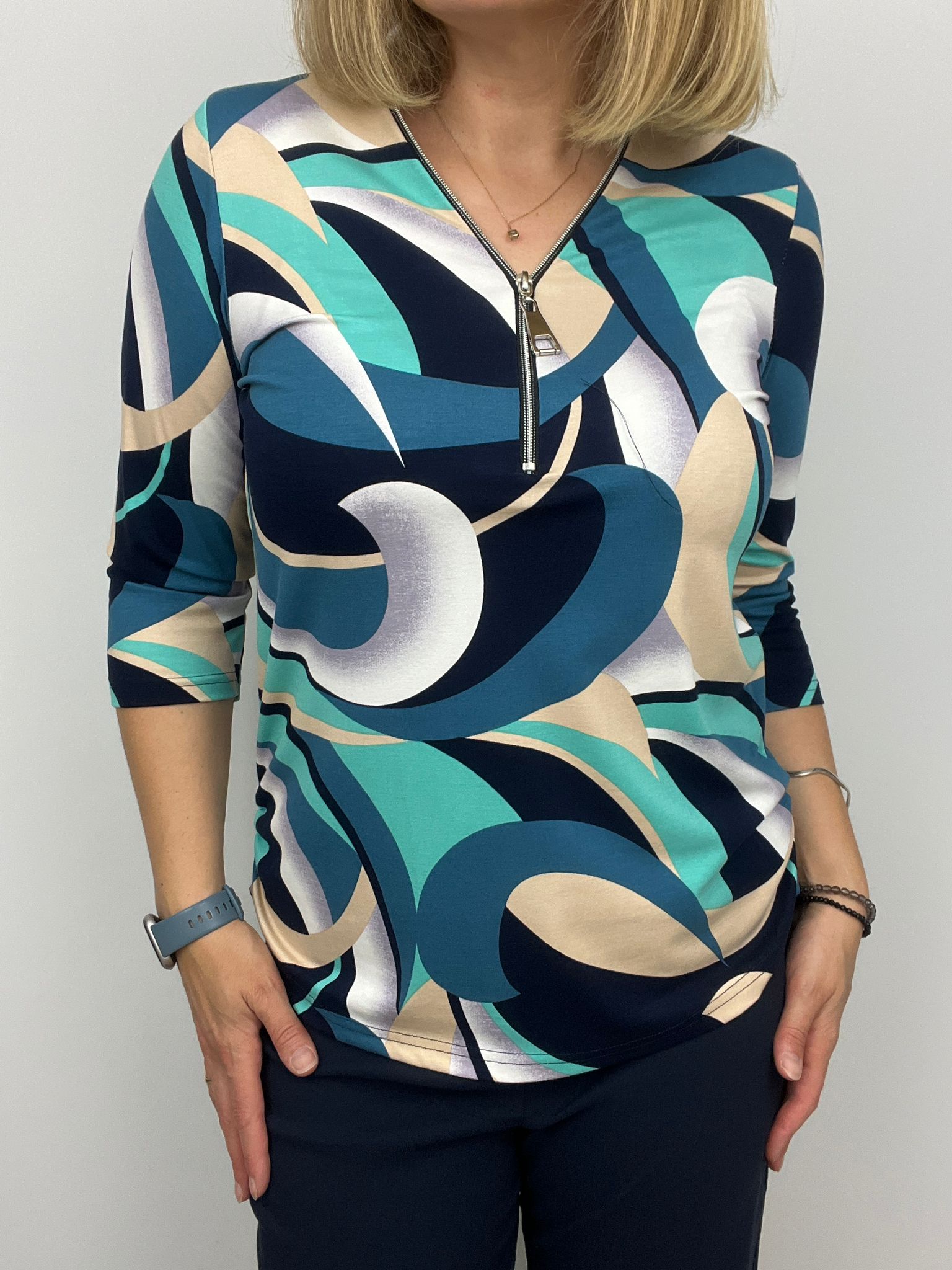 Teal and Navy print zip top with 3/4 sleeves