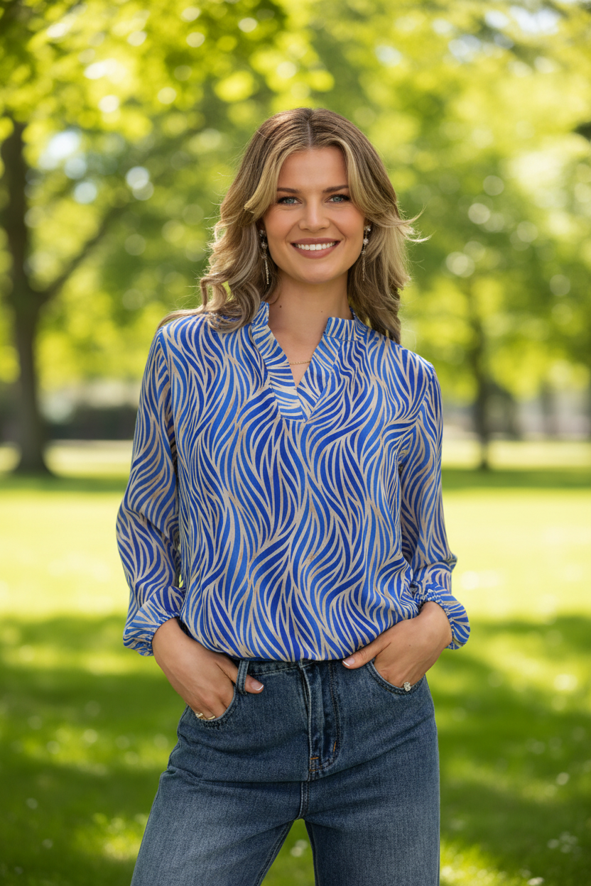 Royal blue animal print top in park - upper body