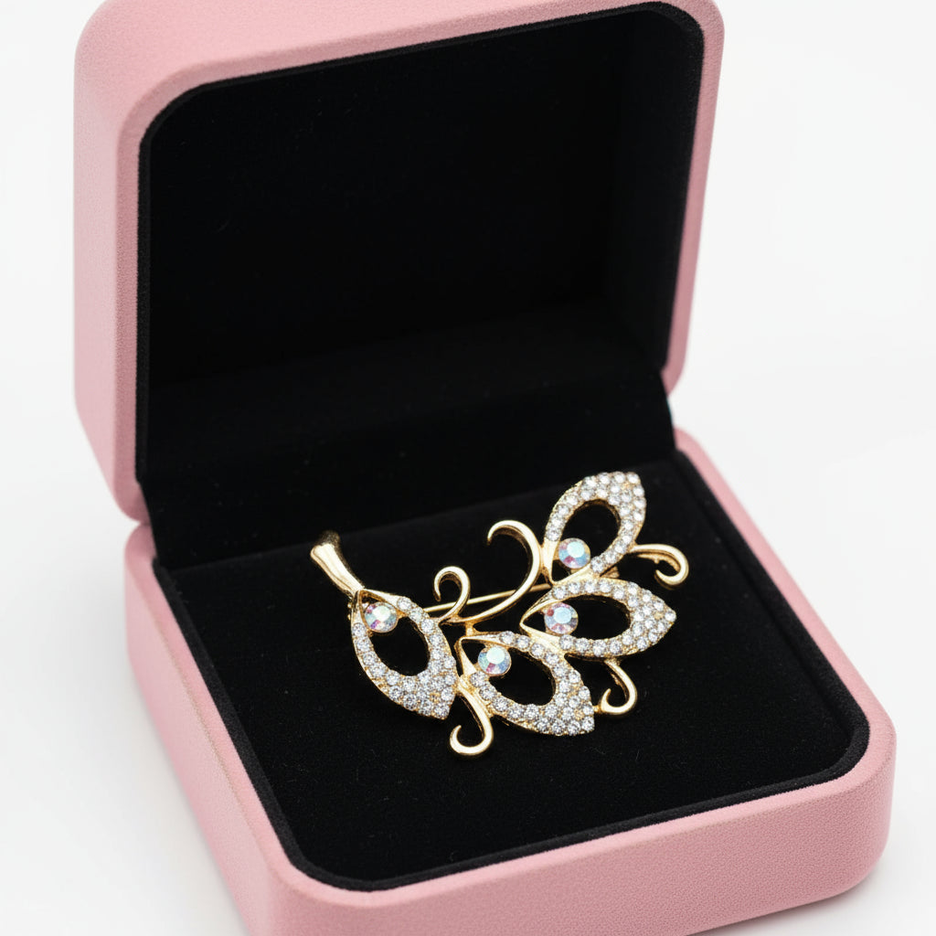 Boxed Crystal and Diamante Gold 4 leaf brooch
