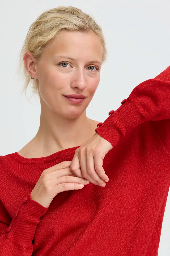 Byoung round neck Shimmer knit with button detail cuffs in Red or Black