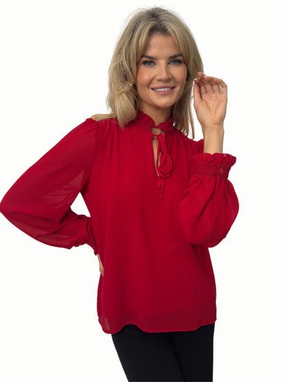 Kate And Pippa Pia Long sleeve blouse with neck tie.