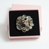 Brooch in pink gift box without lid