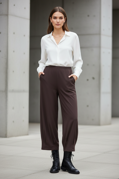 Brown Noen trousers styled with feminine military boots