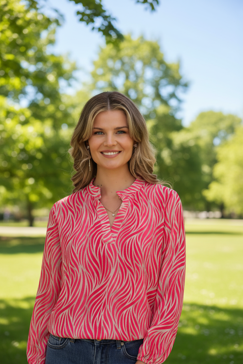 Cerise pink animal print top in park - upper body