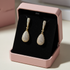 Gold diamante earrings in pink box