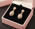 Gold earrings in pink velvet box