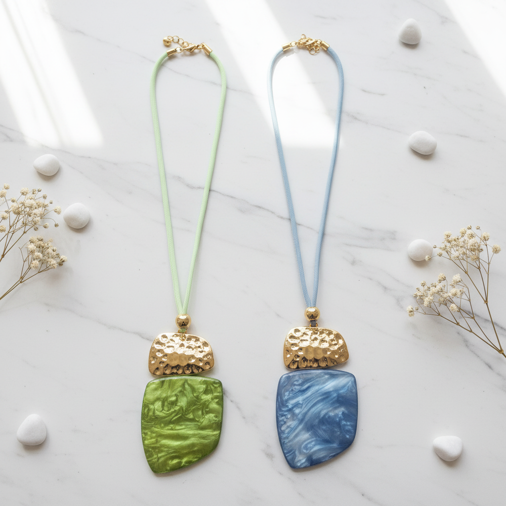 Green and blue pendant necklaces flat lay