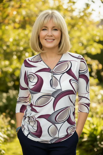 Ilona white burgundy and taupe abstract swirl print zip top lifestyle outdoor image