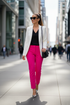 Lady wearing pink trousers in the city