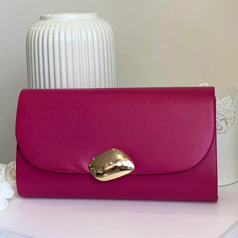 Faux leather clutch bag with gold clasp