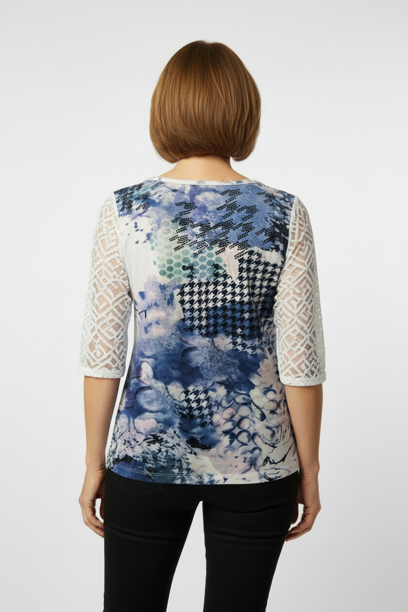 Mature model wearing artistic blue print top - back view