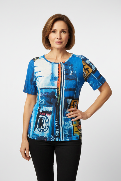 Mature model wearing fitted artistic printed top
