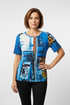 Mature model wearing fitted artistic printed top