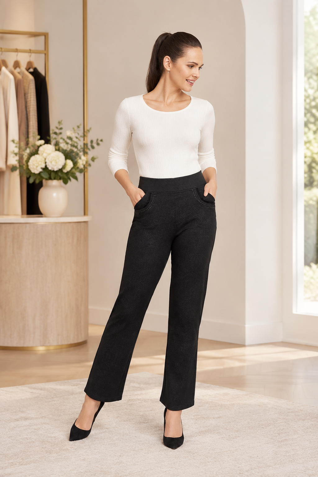 Model wearing black straight-leg trousers with crystal pocket detail