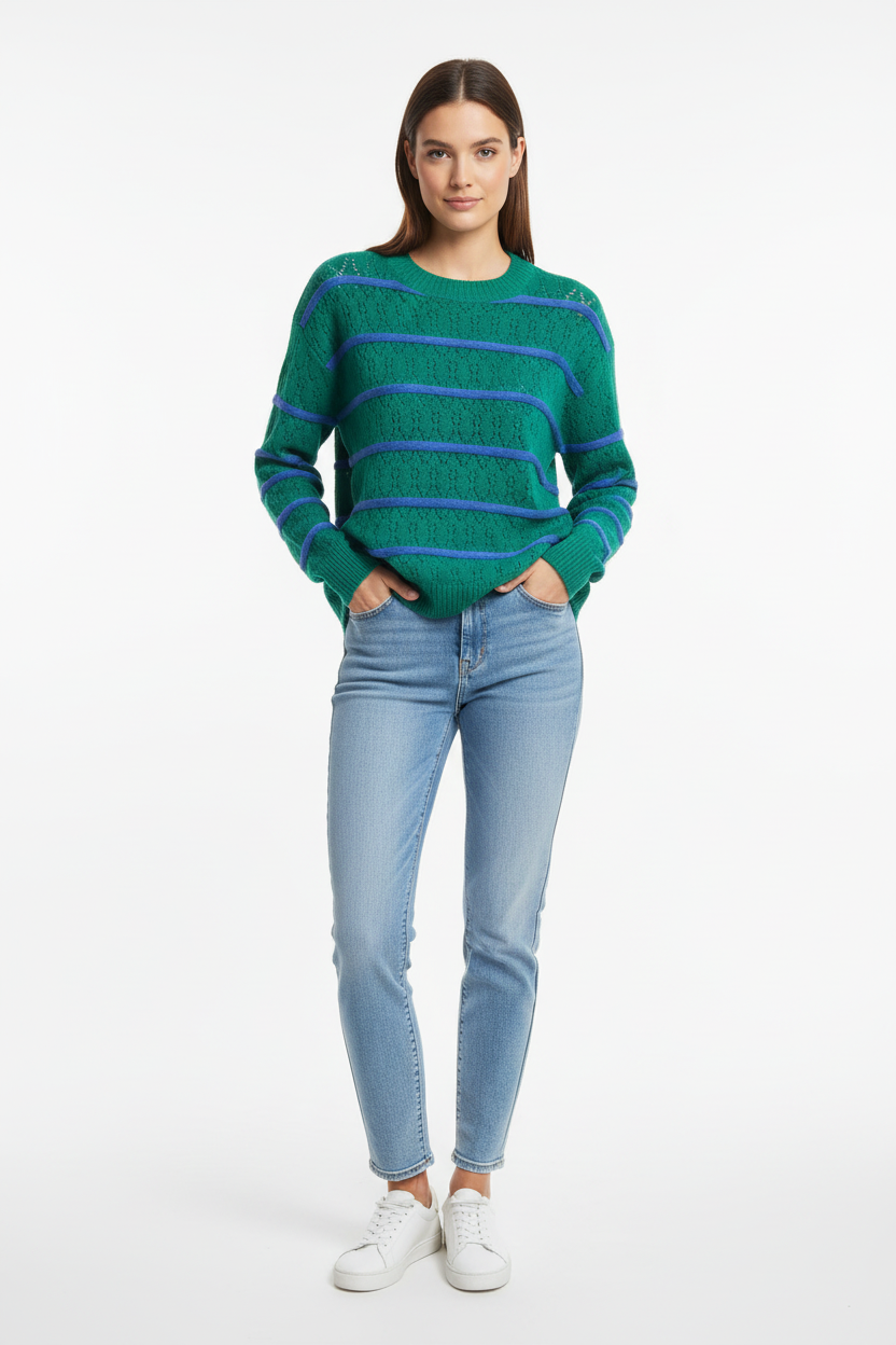 Model wearing green knit with blue stripes