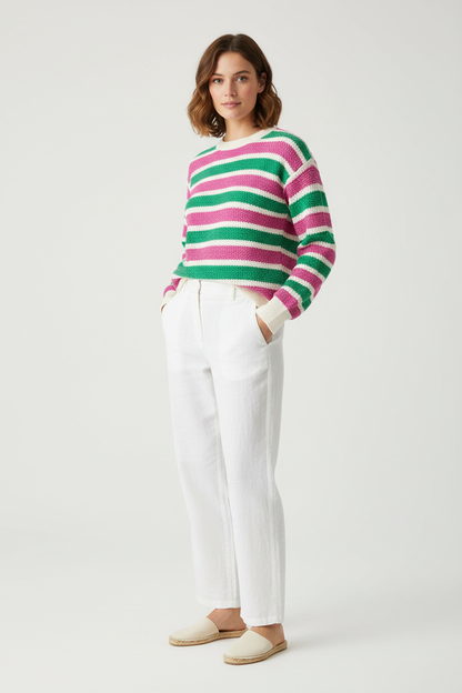 Model wearing pink and green striped jumper