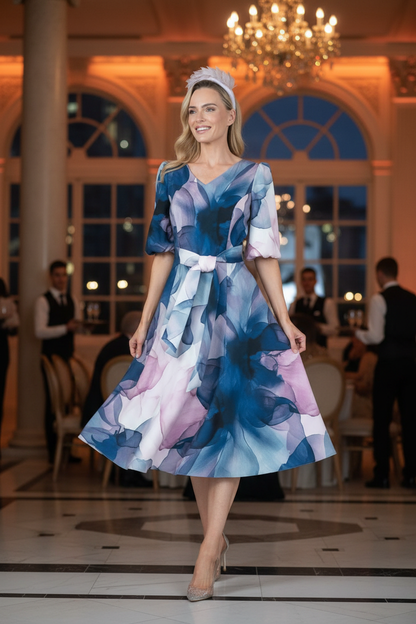 Pink flared dress at event