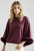Plum knit with fur cuffs model image