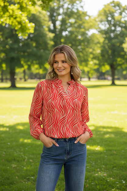 Red animal print top in park - upper body