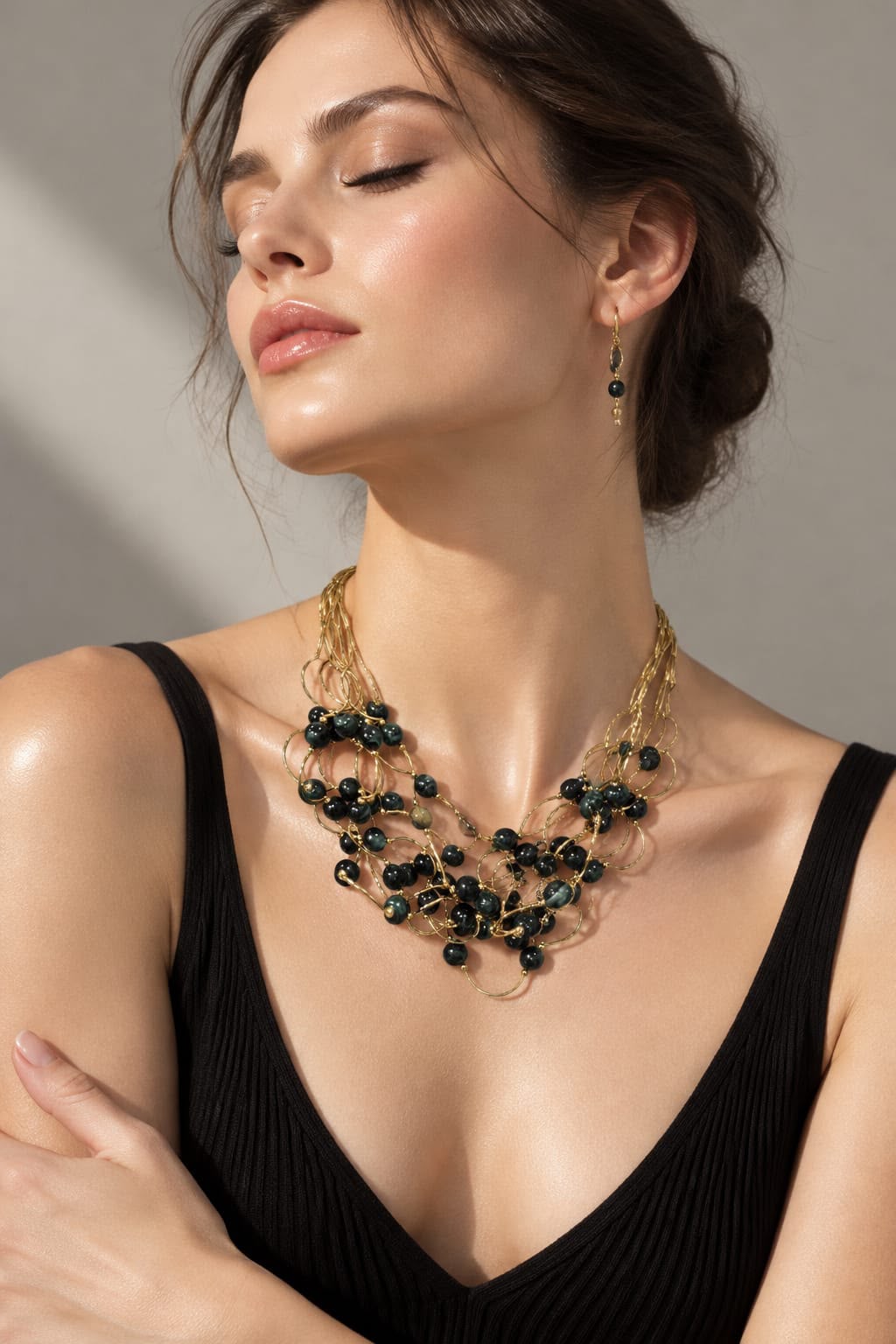 Multi strand gold necklace with scatter green beads