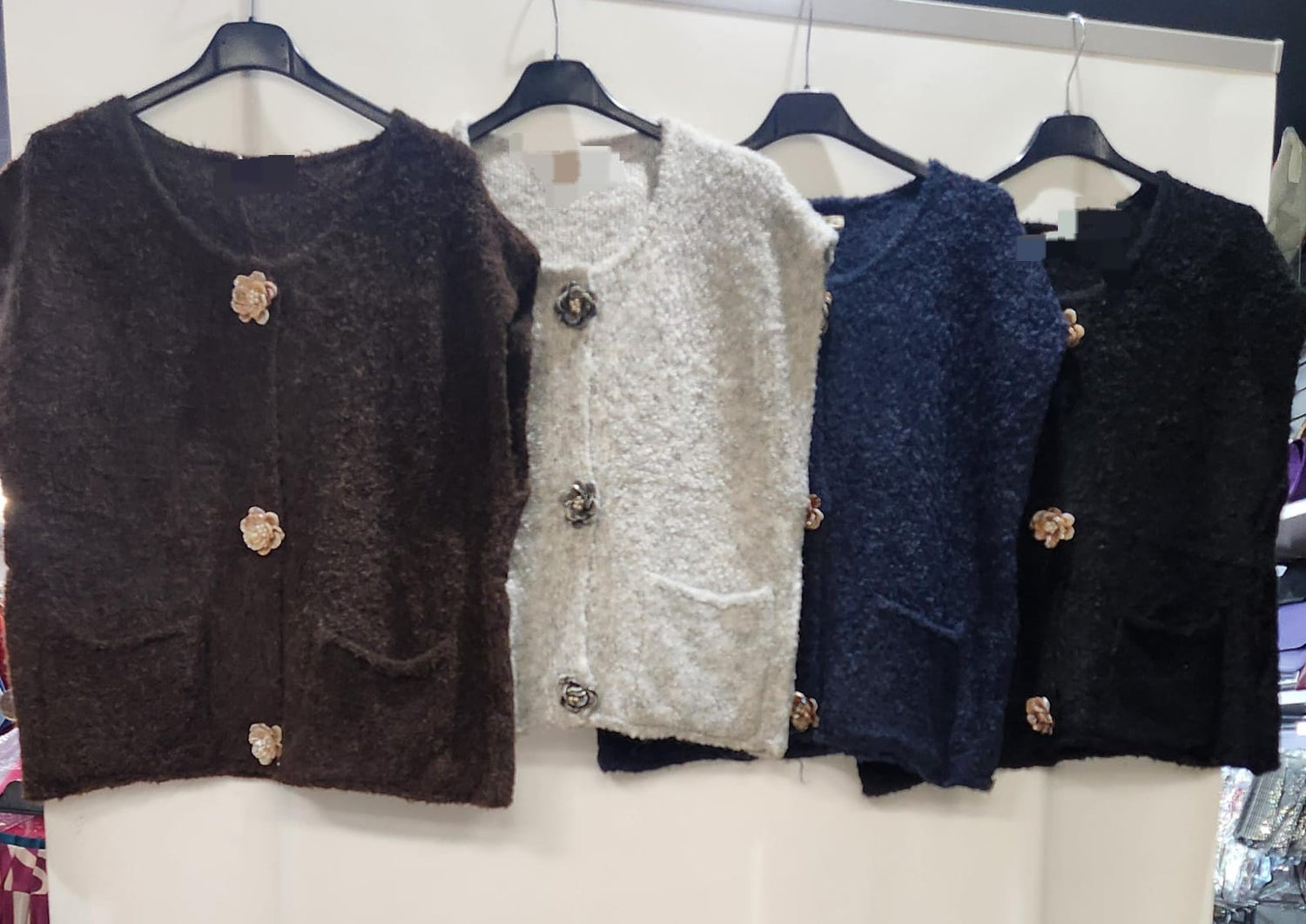 Supersoft Sleeveless knit with fabulous Flower button Detail