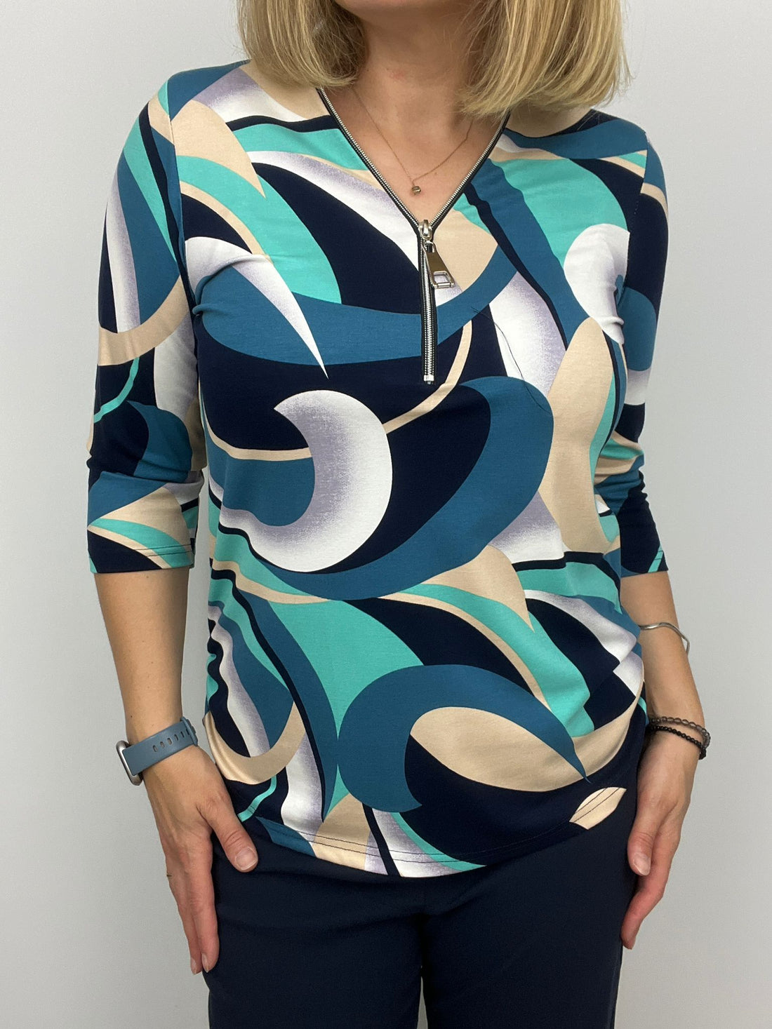 Teal and Navy print zip top with 3/4 sleeves