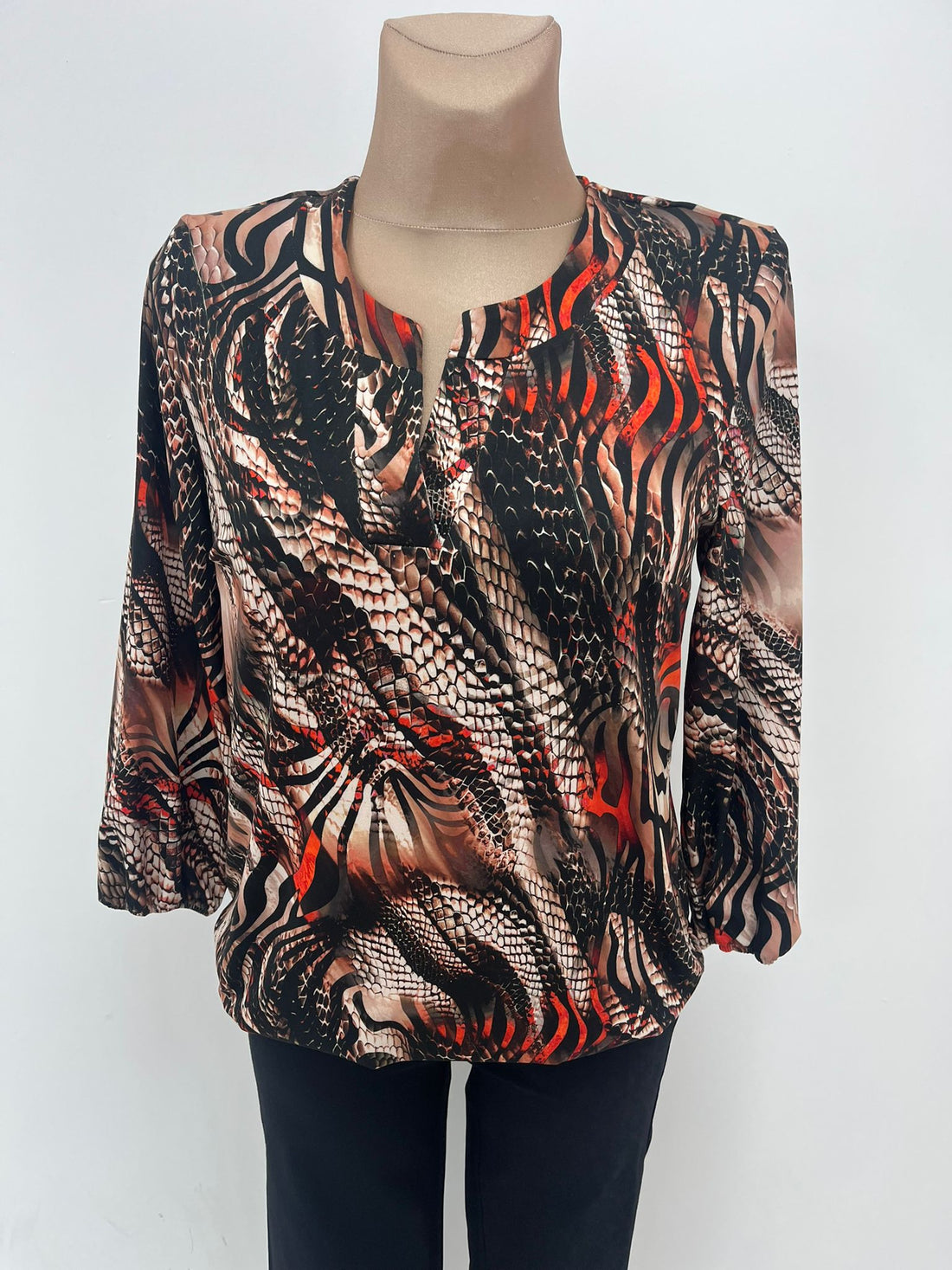 Yew Top with Split v neckline and elastic waistband in tan black mix