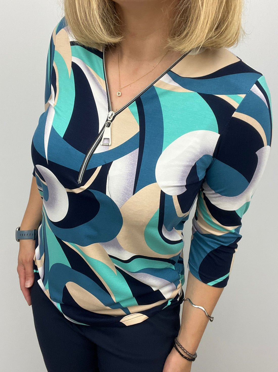 Teal and Navy print zip top with 3/4 sleeves