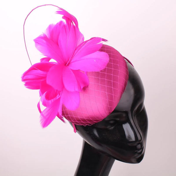 Pillbox style fascinator with feather and spike detail on band D04