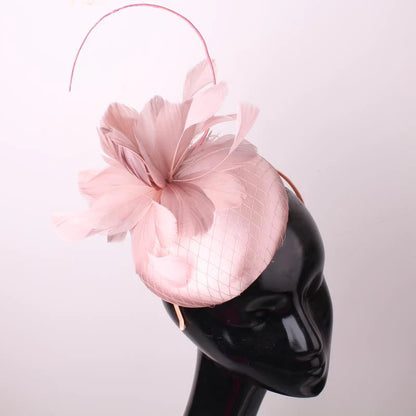 Pillbox style fascinator with feather and spike detail on band D04