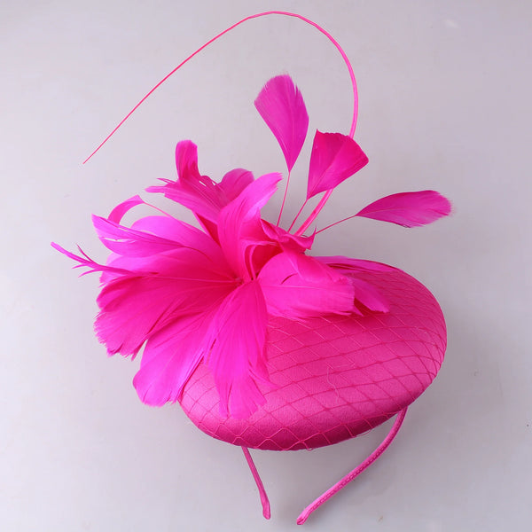 Pillbox style fascinator with feather and spike detail on band D04