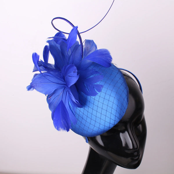 Pillbox style fascinator with feather and spike detail on band D04