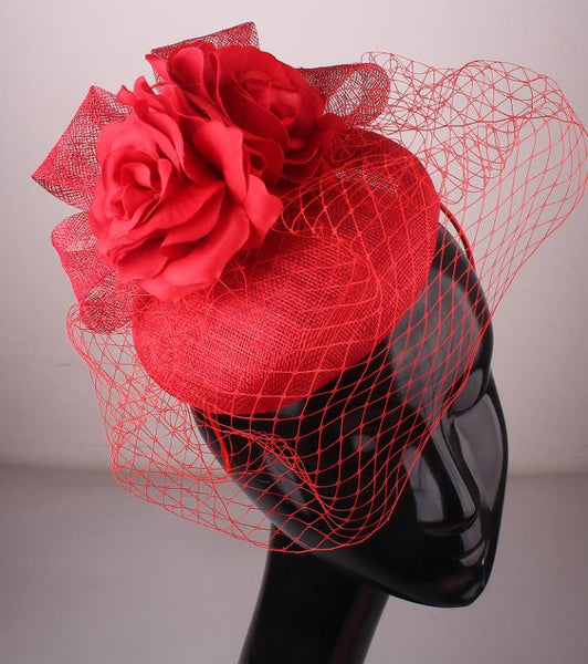 Fascinator hat with flowers and netting detail on band D15