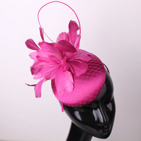 Pillbox style fascinator with feather and spike detail on band D04